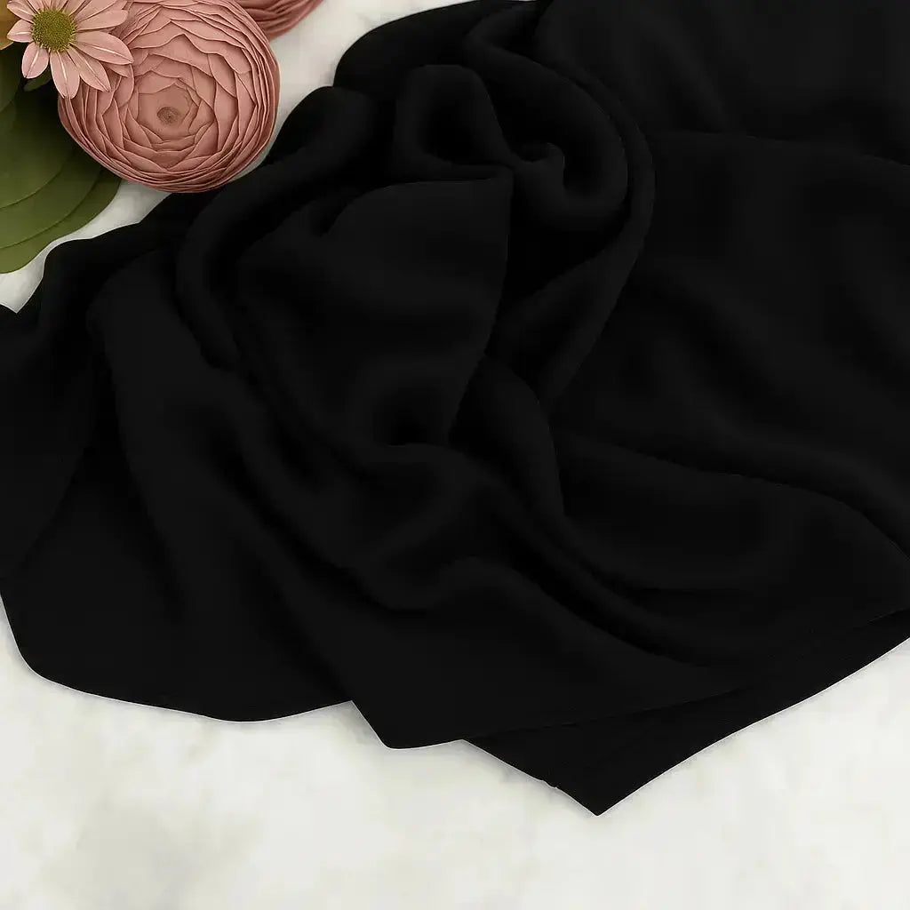 Elegant black chiffon hijab with timeless modest design
Black chiffon hijab draping softly and stylishly
Classic black hijab for versatile modest fashion | Classic Black