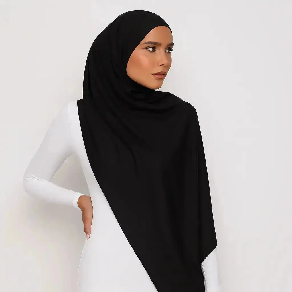 Elegant black chiffon hijab with timeless modest design
Black chiffon hijab draping softly and stylishly
Classic black hijab for versatile modest fashion | Classic Black