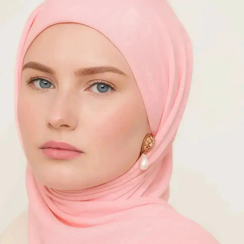 Elegant chiffon hijab in soft pink color with feminine style
Pink chiffon hijab draping beautifully, modest and elegant
Lightweight pink hijab perfect for daily wear or special occasions | Soft Pink