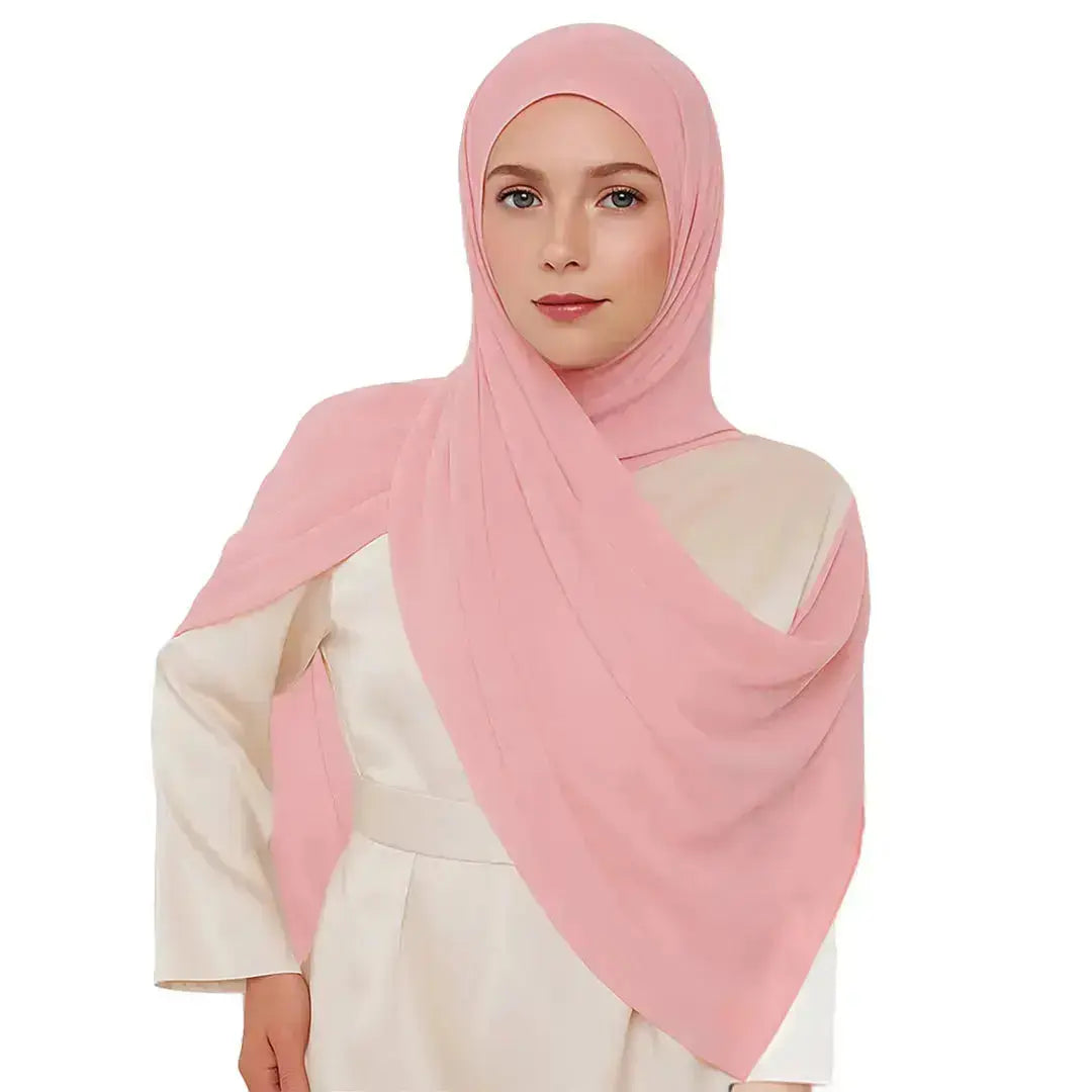 Elegant chiffon hijab in soft pink color with feminine style
Pink chiffon hijab draping beautifully, modest and elegant
Lightweight pink hijab perfect for daily wear or special occasions | Soft Pink