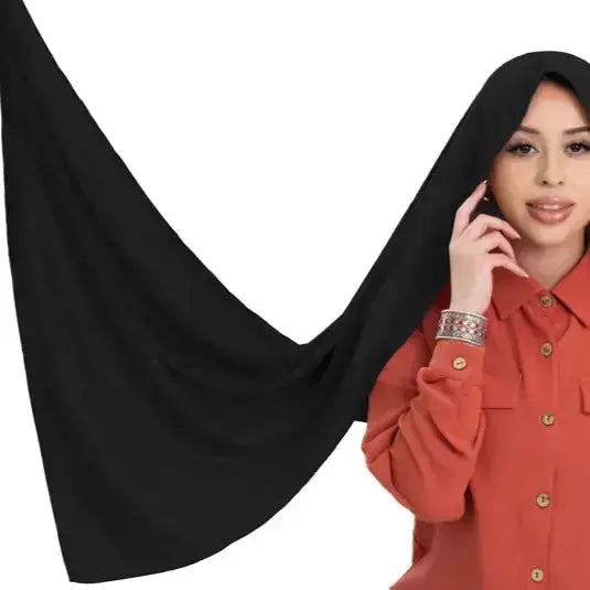 Elegant black chiffon hijab with timeless modest design
Black chiffon hijab draping softly and stylishly
Classic black hijab for versatile modest fashion | Classic Black