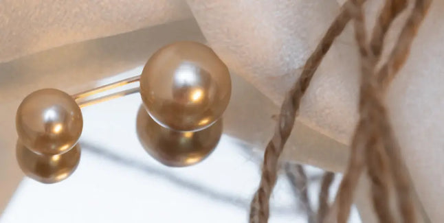 Double-sided pearl bead hijab pins for a secure and elegant hold, featuring smooth round pearls on both ends. Perfect for modest fashion and delicate fabrics | Beige