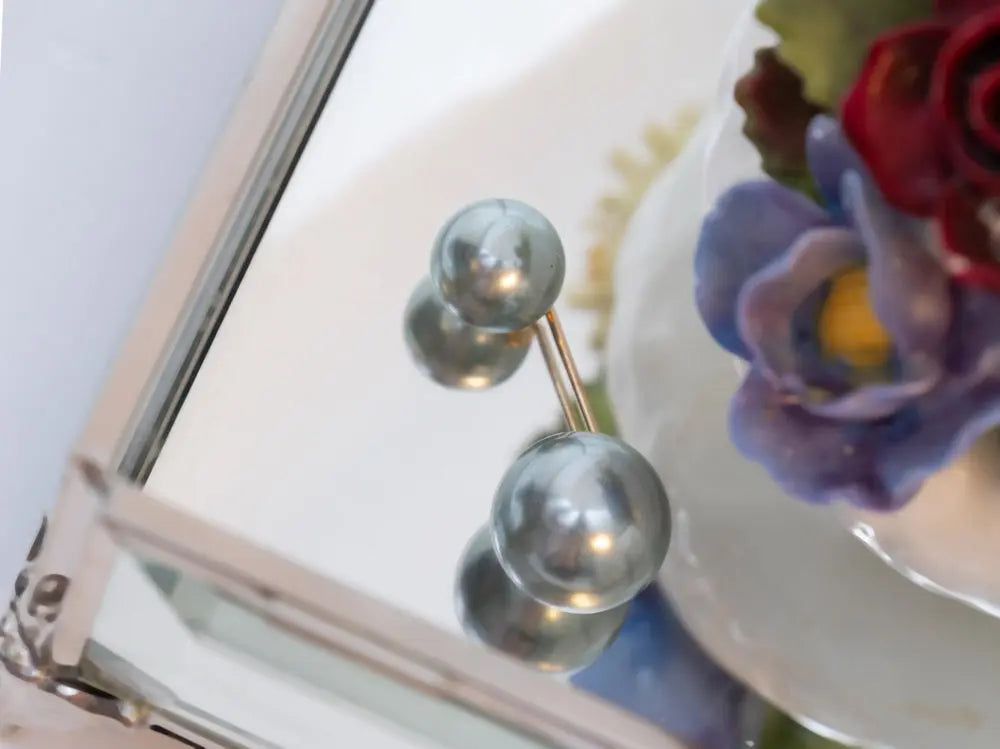 Double-sided pearl bead hijab pins for a secure and elegant hold, featuring smooth round pearls on both ends. Perfect for modest fashion and delicate fabrics | Gray