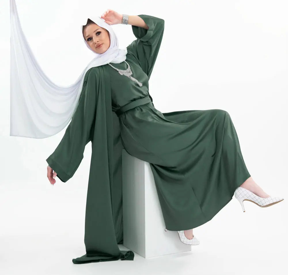 Three-piece textured silk abaya set with a flowing cardigan, matching liner, and adjustable belt for a sophisticated modest look. Lightweight, breathable | Green