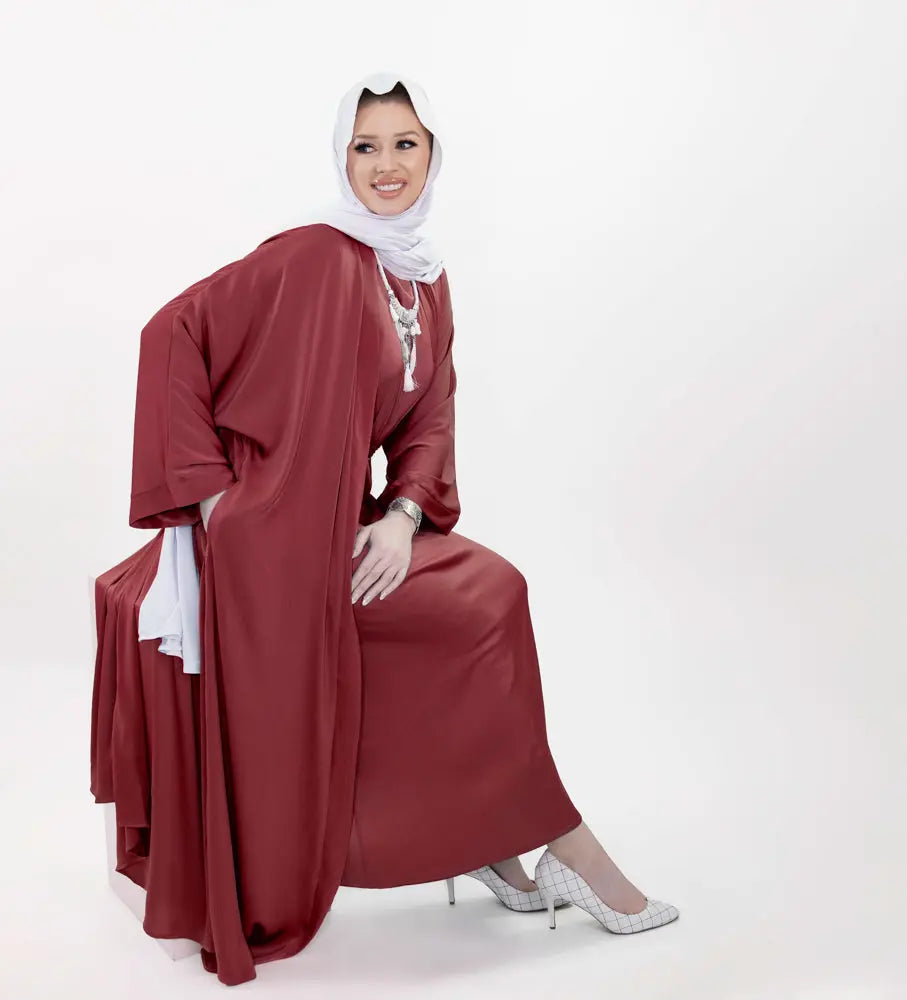 Three-piece textured silk abaya set with a flowing cardigan, matching liner, and adjustable belt for a sophisticated modest look. Lightweight, breathable | Red