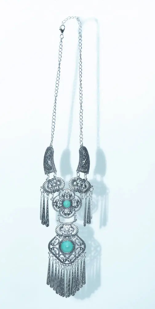 Antique silver necklace, featuring intricate detailing and timeless charm.
