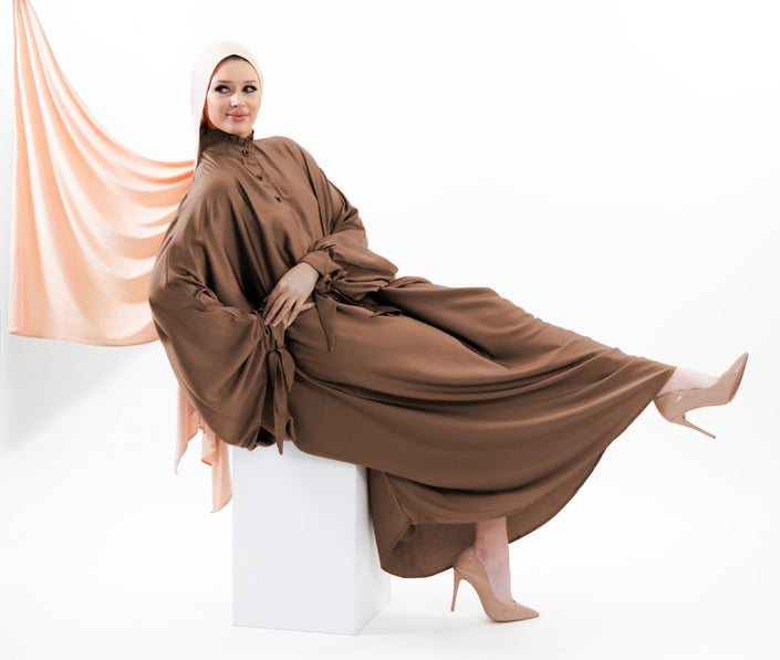 Soft silk stylish abaya featuring bow sleeves, crafted for comfort and sophistication | Brown