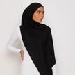Elegant black chiffon hijab with timeless modest design
Black chiffon hijab draping softly and stylishly
Classic black hijab for versatile modest fashion | Classic Black