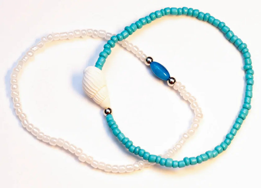 Set of two anklets featuring seashell accents, perfect for beach-inspired style