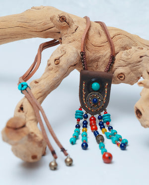 Hippie style long necklace featuring eclectic beads and bohemian-inspired elements | Brown