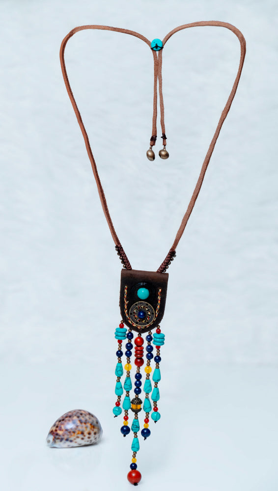 Hippie style long necklace featuring eclectic beads and bohemian-inspired elements | Brown