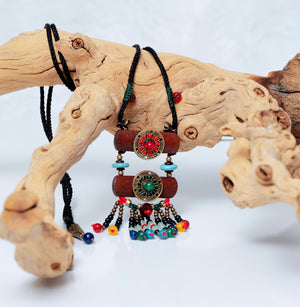 Hippie style long necklace featuring eclectic beads and bohemian-inspired elements | Red