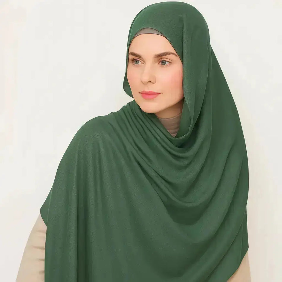 Emerald Mist Madina Silk Hijab – Deep green, soft, non-slip, and breathable fabric. Semi-matte finish with a smooth texture, perfect for modest fashion. | Emerald Mist