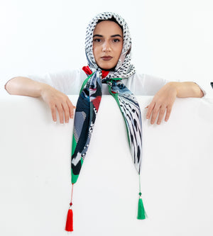 Luxurious Palestinian silk hijab scarf featuring intricate cultural designs.