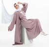 Three-piece silk Abaya set crafted from premium silk fabric, showcasing a captivating textured lines pattern. Includes a flowing gown, matching liner, and coordinating belt | Pink