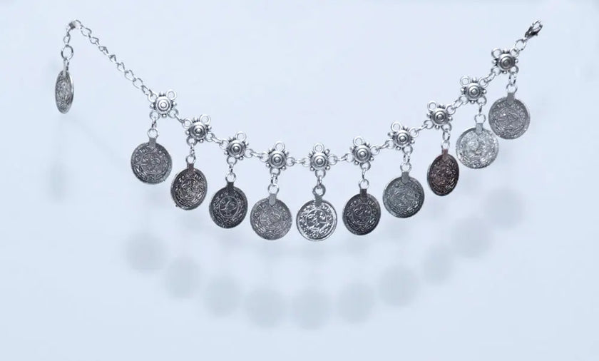 Silver anklet with coin charms