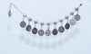 Silver anklet with coin charms, perfect for bohemian-inspired style