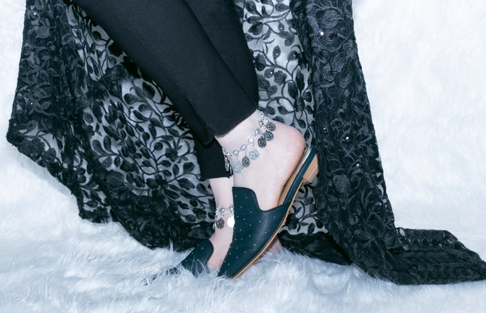 Silver anklet with coin charms, perfect for bohemian-inspired style
