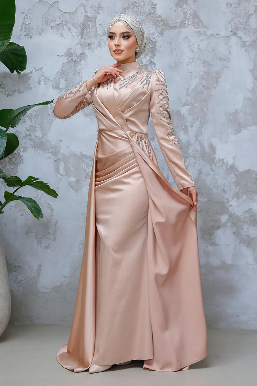 Champagne blush satin modest gown with beaded long sleeves, high neckline, and a dramatic floor-length cape. Elegant formal dress for weddings or events.