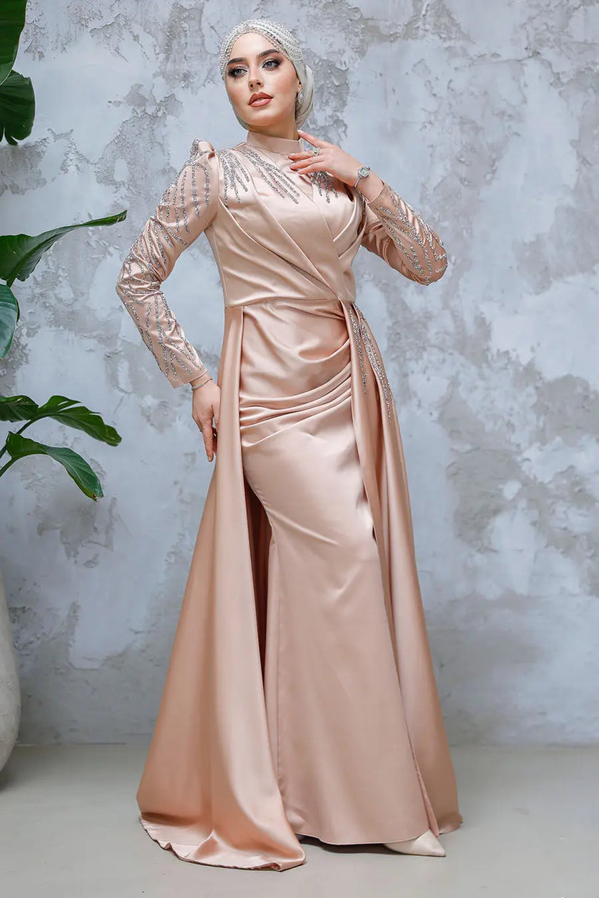 Champagne blush satin modest gown with beaded long sleeves, high neckline, and a dramatic floor-length cape. Elegant formal dress for weddings or events.