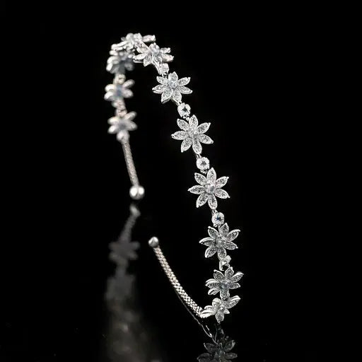 Elegant crystal floral headband with delicate white flowers, perfect for bridal, wedding, and formal occasions. Lightweight, stylish, and comfortable fit.