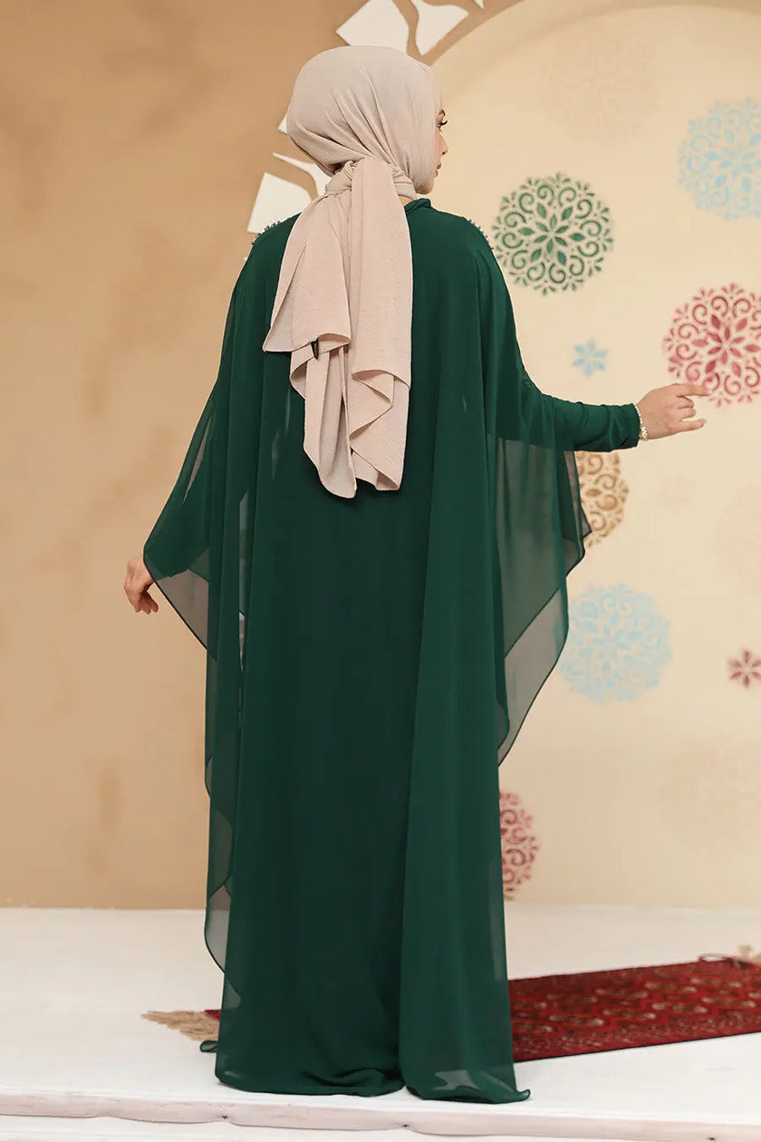 Emerald Green crepe abaya in kaftan style with silver embellishment detail. Flowy chiffon sleeves and modest design perfect for weddings or formal events.