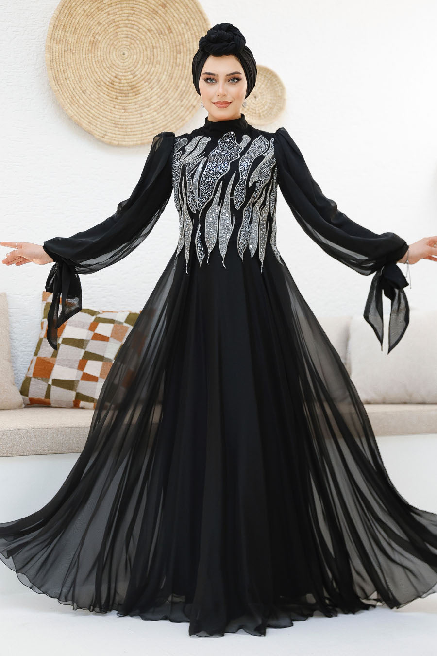 Modest midnight black chiffon gown with silver sequin embellishments on the bodice and back. Elegant full-length formal dress with flowy sleeves.