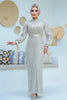 A woman wearing a modest silver sequin maxi gown with a satin waist belt, perfect for formal events and Eid – Zari Hijabeez