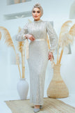 A woman wearing a modest silver sequin maxi gown with a satin waist belt, perfect for formal events and Eid – Zari Hijabeez
