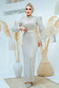 A woman wearing a modest silver sequin maxi gown with a satin waist belt, perfect for formal events and Eid – Zari Hijabeez