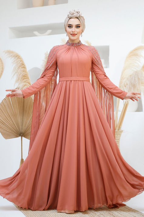 Terracotta rose chiffon gown with modest high neckline and elegant beaded embellishments on shoulders and cape sleeves. Perfect for weddings and special events.